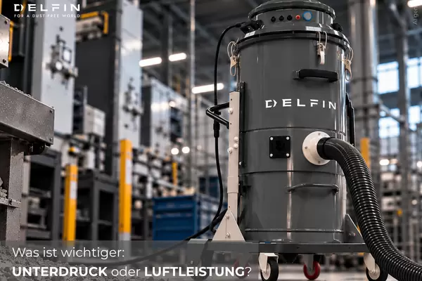 Industriesauger mit Frage, was wichtiger ist: Unterdruck oder Luftleistung